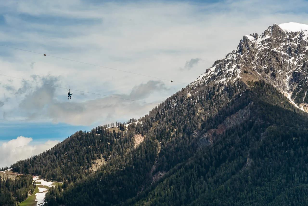 Panoramic flight with snow-capped mountain behind