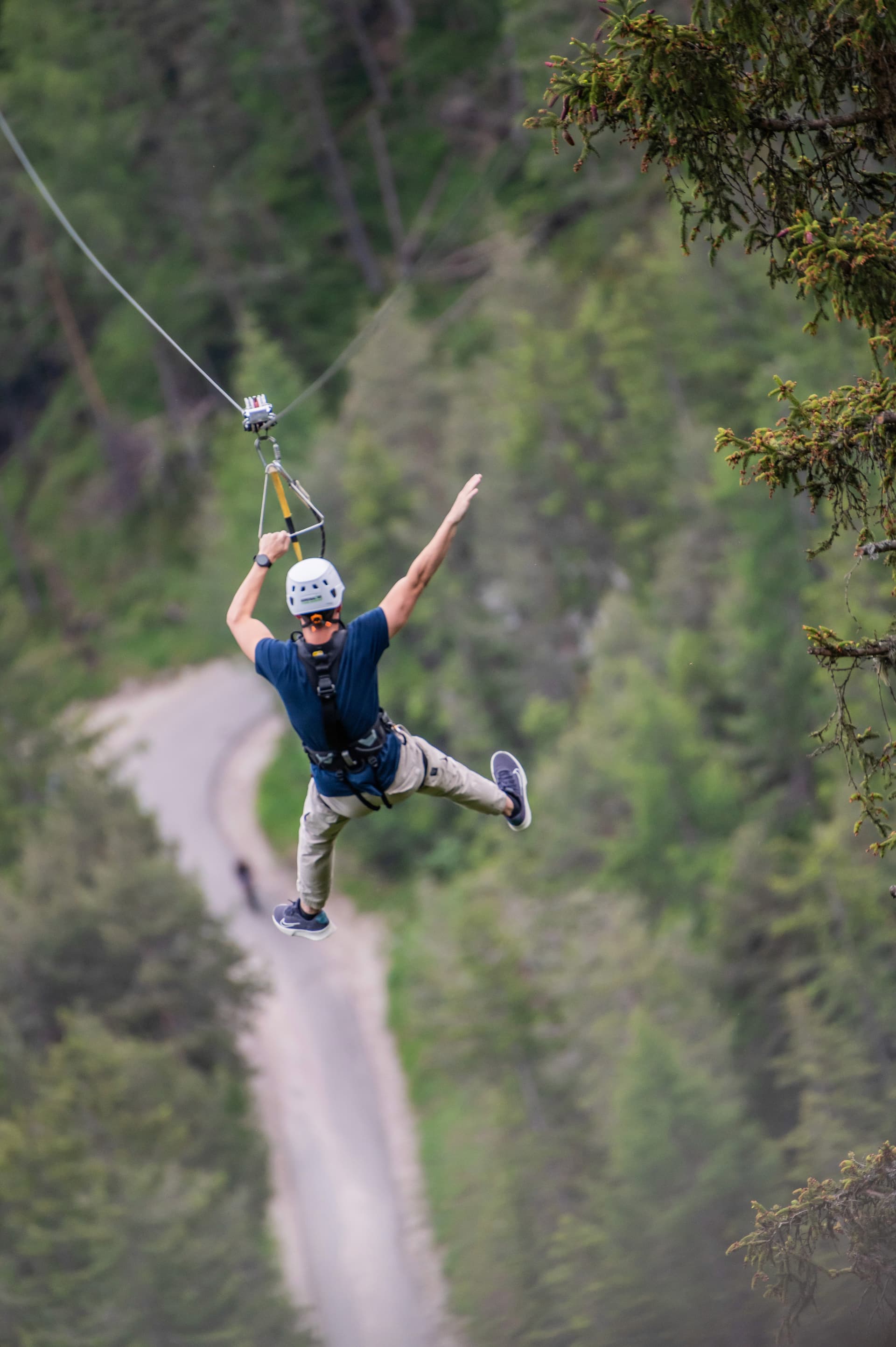 Flying with open arms above the valley